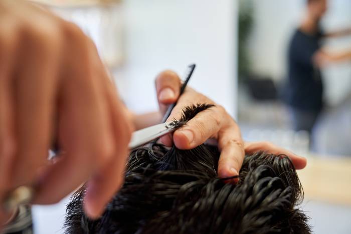 crop-hairstylist-cutting-hair-of-client-2022-04-18-23-36-13-utc (1)